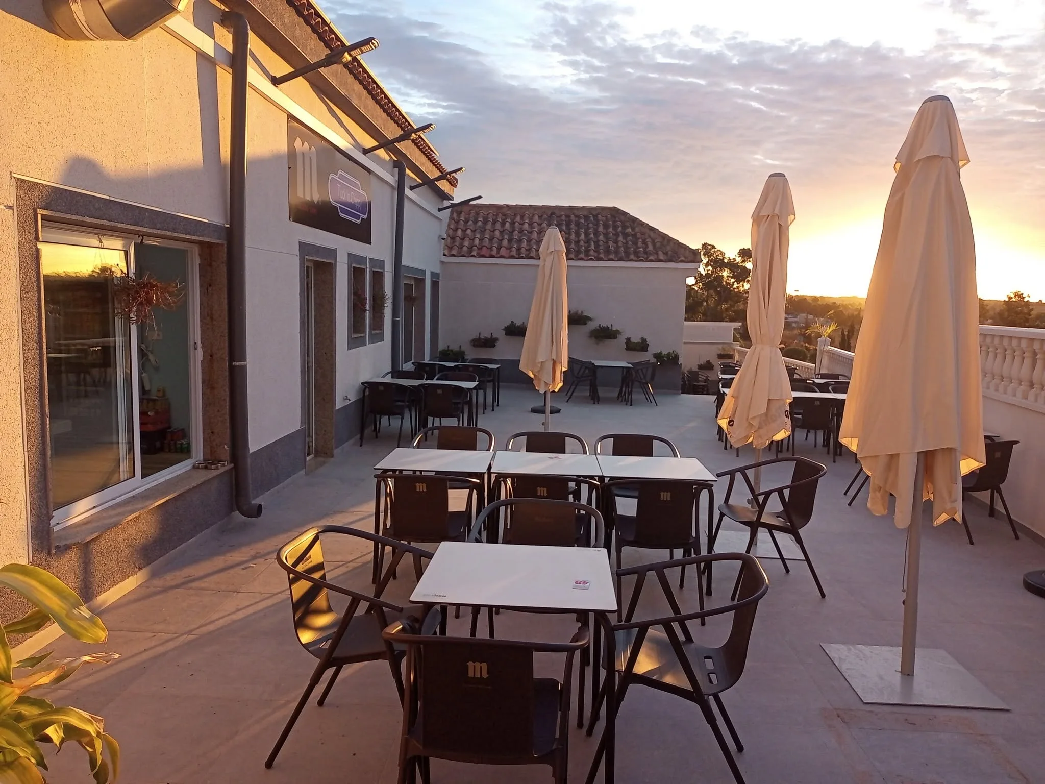 Terrace seating at sunset, Tuck In Chippy
